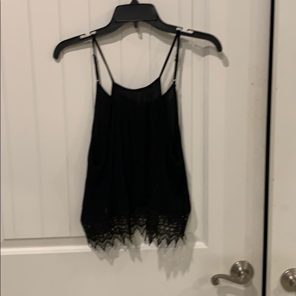 Black sleeveless crop with lace trim.